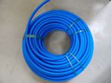 a close up of a blue hose on a floor