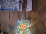 a guitar that is sitting on the floor in the room
