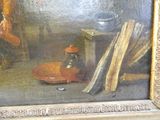 une photo d'un tableau représentant un homme dans une cuisine