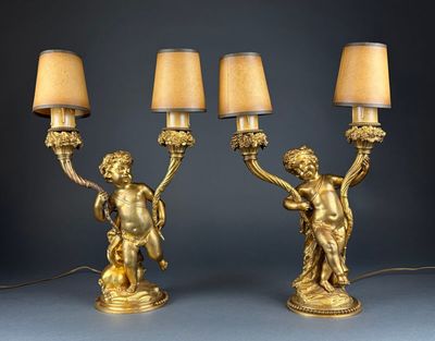 pair of antique brass figurines with lamps and shades on them