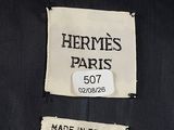 the label on a black jacket reads hermes paris, made in france
