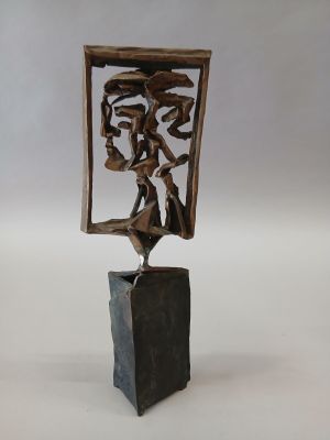 statue of a woman in a mirror with a bird on a rock