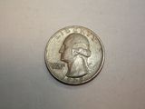 a close up of a coin on a white surface