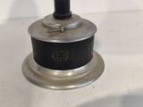 a close up of a small metal object on a table