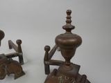 pair of antique cast iron candlesticks with wooden bases