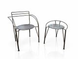 pair of metal chairs with a glass top on a white surface