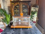 a small glass box on top of a wooden table
