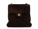 a chanel brown sued shoulder bag with gold hardware