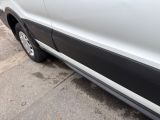 a white van parked on the side of the street