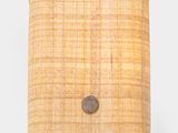 an image of a wall light with a woven shade on it