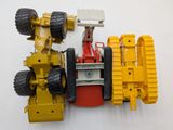 a close up of a toy truck with a crane on it ' s back