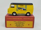yellow toy van with a black roof sitting on top of a red box