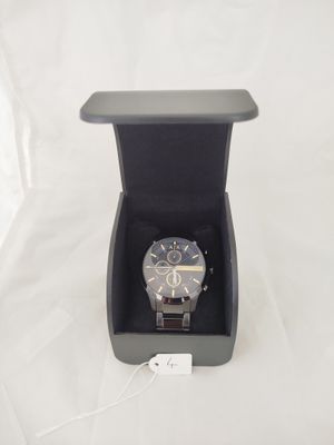 a watch in a black box on a white surface