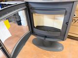 a stove that is sitting in the middle of a room
