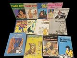 a lot of books that are on the table