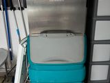 a machine that is sitting on the floor in the kitchen