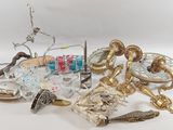 a lot of glass and metal items on the table