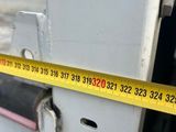a measuring tape on the side of a door
