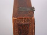 a small wooden box with a design on it