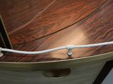 a close up of a wooden desk with a computer on top of it