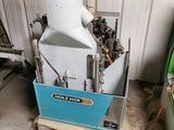 a machine that is sitting on a pallet in a garage