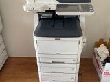a printer that is sitting on top of a cart