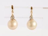pair of pearl and diamond earrings in yellow gold