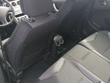 the interior of a car with two seats and a steering wheel