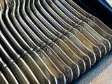 a lot of silver spoons in a blue case