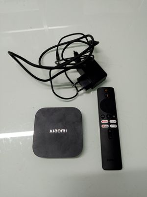 a remote control and a box on a table
