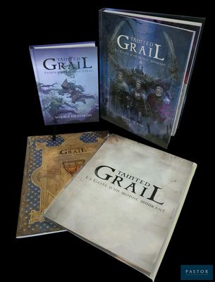 three books are sitting on a black surface with a black background