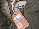 an image of a tag on the back of a jacket with a tag attached to it