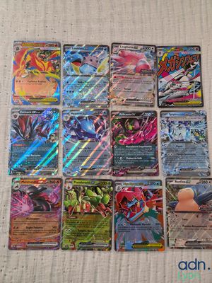 a bunch of pokemon cards sitting on top of a table