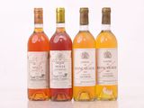 trois bouteilles de vin posées l'une à côté de l'autre sur une table