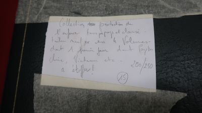 a piece of paper with writing on it sitting on a chair