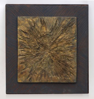 an abstract painting of a sunburst on a wooden surface