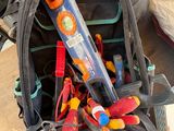 a back pack with tools in it sitting on the floor