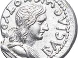 a close up of a silver coin with a woman on it