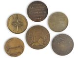 six different types of coins are shown on a white surface