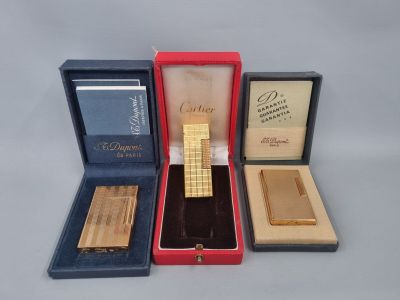 three different types of lighters are in a box on a table