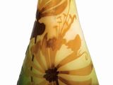 a vase that has a yellow and black design on it