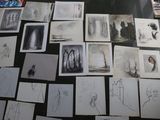 a lot of drawings on the table with pictures on it