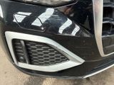 a close up of a car ' s front grill and front bumper