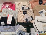 a lot of men ' s shirts on display in a store
