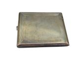 an antique silver cigarette case with a metal cover