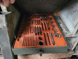 a metal box with a bunch of tools inside of it