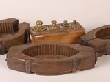 three wooden ashtrays with brass fittings and a wooden box