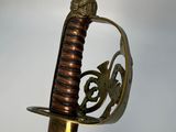 a close up of a sword with a metal handle