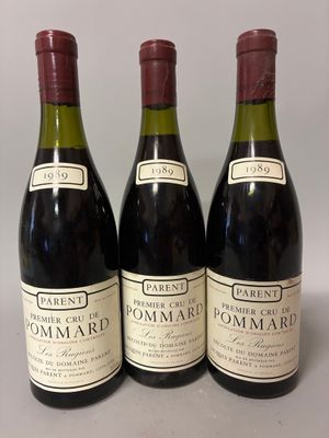 three bottles of wine sitting on top of a table next to each other