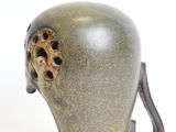 a vase with a handle that is shaped like an elephant